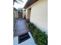Charming walkway leading to the home, adorned with vibrant green landscaping and a welcoming entrance mat at 1880 N Crystal Lake Dr # 3, Lakeland, FL 33801