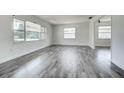 Bright living room with modern floors and large windows, perfect for comfortable living and natural light at 2736 Shannon Rd, Orlando, FL 32806