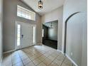 Inviting entryway with tiled flooring, high ceilings, and natural light creates a great first impression at 3049 Buckeye Pointe Dr, Winter Haven, FL 33881