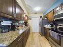 Well-equipped kitchen with granite countertops and stainless steel appliances at 4519 Se 140Th Pl, Summerfield, FL 34491