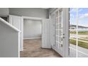 Inviting entryway featuring stylish flooring and bright french doors, welcoming you into the home at 4905 Pall Mall E St, Kissimmee, FL 34758