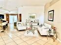 Bright living room with tile floors, comfortable seating, and stylish decor at 6704 Westlake Blvd, Orlando, FL 32810