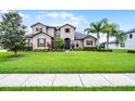 Charming two-story home with well-maintained lawn and lush landscaping, creating great curb appeal at 2260 Grayling St, Orlando, FL 32820