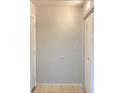 Bright hallway featuring tiled flooring, a coat closet, and neutral paint that gives it a clean and modern look at 2468 Citrus Club Ln # 502, Orlando, FL 32839