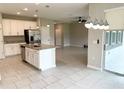 Open-concept kitchen with stainless steel appliances, granite countertops and a large island at 6268 Great Bear Dr, Lakeland, FL 33805