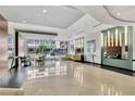 Bright lobby with high ceilings, stylish seating, modern lighting, and expansive windows overlooking the street at 101 S Eola Dr # 810, Orlando, FL 32801
