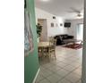 Spacious living room with tile flooring, modern decor, and plenty of natural light at 116 Blackwater Ct, Kissimmee, FL 34743