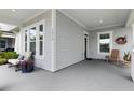 Inviting front porch with ample seating space, perfect for relaxing and enjoying the neighborhood views at 1212 Civitas Way, Winter Garden, FL 34787