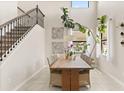 Bright dining area with high ceilings, staircase and large windows, perfect for Gathering meals at 1501 Prairie Oaks Dr, St Cloud, FL 34771
