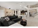 Bright, open living area features a soaring ceiling, staircase and seamless flow to the kitchen at 1501 Prairie Oaks Dr, St Cloud, FL 34771
