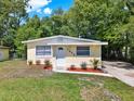 Attractive single story home with a well-manicured lawn and colorful landscaping at 1906 S Summerlin Ave, Sanford, FL 32771