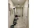 Bright entryway with tile floors, leading to the front door; features a decorative 'Gathering Rules' sign at 4427 Blackbird St, Kissimmee, FL 34746