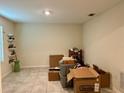 Versatile room with tile flooring, shelves, and good natural light from the window at 4427 Blackbird St, Kissimmee, FL 34746