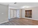 Bright living room with gray walls, new laminate flooring, and natural light at 5039 Jamaica # 10, Orlando, FL 32808