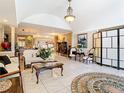 Spacious living room featuring neutral paint, tile flooring, and ample natural light at 5852 Medinah Way, Orlando, FL 32819
