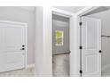 Bright bedroom featuring natural light and wood floors at 8202 Sw 123Rd Ter, Dunnellon, FL 34432