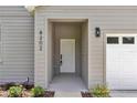 Welcoming front entrance with a white door and well-kept surroundings at 8202 Sw 123Rd Ter, Dunnellon, FL 34432