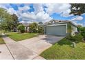 Beautiful home with a spacious driveway and well-maintained lawn in a desirable neighborhood at 9563 Myrtle Creek Ln, Orlando, FL 32832