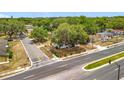Overhead view of the property surrounded by lush greenery in a well-established neighborhood, and close to paved roads at 1000 E Dixie Ave, Leesburg, FL 34748