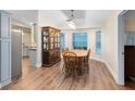 Well-lit dining room features hardwood floors, a beautiful hutch, and bright windows at 1014 Seminole Creek Dr, Oviedo, FL 32765