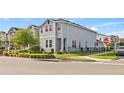 Charming two-story home with a manicured lawn and wrought iron fence on a corner lot at 15358 Arcadia Bluff Loop, Winter Garden, FL 34787
