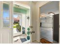 Inviting foyer featuring tile flooring and a view to the garage entrance at 1548 Challenger Ave, Davenport, FL 33897