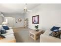 Bright living room with natural light and neutral tones creating a cozy atmosphere at 1548 Challenger Ave, Davenport, FL 33897
