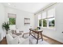 Bright office space features hardwood floors, a comfortable seating area, and ample natural light at 2407 Lafayette Ave, Winter Park, FL 32789