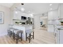 Modern kitchen with granite counters, stainless steel appliances, and breakfast bar seating at 2550 Barren Oak Ct, Deland, FL 32720