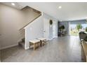 Inviting entryway featuring tiled flooring, stairway and ample natural light with an open-concept design at 2712 Golden Trout Ln, Edgewater, FL 32141