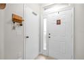 Bright foyer with a tile floor, white doors, and a key rack for added convenience at 2810 San Jacinto Cir # 2810, Sanford, FL 32771