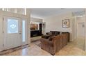 A spacious living room boasts a modern TV and comfortable seating with tile floors at 322 Huron Dr, Kissimmee, FL 34759