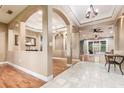 Elegant entryway featuring marble flooring, wood accents, and arched doorways leading to other living spaces at 433 Tangerine Ave, Lake Helen, FL 32744