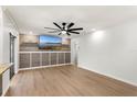 Bright living room featuring a modern ceiling fan, recessed lighting, and stylish decor at 5338 Tangerine Ave, Winter Park, FL 32792