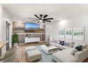 Bright living room featuring a modern ceiling fan, recessed lighting, and stylish decor at 5338 Tangerine Ave, Winter Park, FL 32792