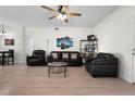 Spacious living room features bright hardwood floors, modern ceiling fan, and an open layout at 725 N Grandview Ave, Daytona Beach, FL 32118