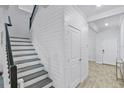 Stylish staircase with shiplap accents and modern design at 1123 Dora Parc Ln, Mount Dora, FL 32757