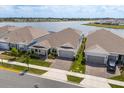 Aerial view of modern homes with lake views, showcasing the desirable neighborhood at 13462 Panama Beach Ct, Orlando, FL 32827