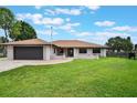 Charming single-story home with a well-maintained lawn and inviting curb appeal on a sunny day at 1620 Texas Ct, Tavares, FL 32778
