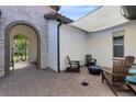 Outdoor patio with comfortable seating, fire pit, and shade, perfect for entertaining at 16696 Otterchase Ln, Winter Garden, FL 34787