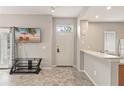 Inviting living room with tile floors and neutral paint, featuring a tv and a doorway to the exterior at 2204 San Vittorino Cir # 102, Kissimmee, FL 34741