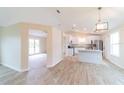 Bright and spacious kitchen with an island, stainless steel appliances, and modern finishes at 2486 Ainsworth Ave, Deltona, FL 32738