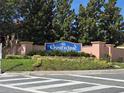 Welcoming Crestwynd community sign with mature landscaping and crosswalk for pedestrian safety at 2662 Mayaguana St, Kissimmee, FL 34747