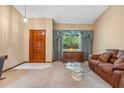 Inviting living room with large window, neutral color scheme, and cozy furniture at 360 Pineview St, Altamonte Springs, FL 32701