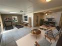 Versatile space for fitness, work, and relaxation; bright and airy with neutral tones and modern furnishings at 3739 S Fern Creek Ave, Orlando, FL 32806