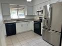Modern kitchen features sleek, stainless steel appliances, granite countertops, and ample cabinet space at 3739 S Fern Creek Ave, Orlando, FL 32806