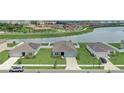 An aerial view showcasing the home's location near a pond and walking trails at 392 Citrine Loop, Kissimmee, FL 34758