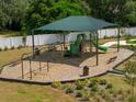 Community playground with swings, slides, and shaded seating areas, perfect for Gathering fun at 6014 Vision Rd, St Cloud, FL 34771