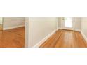 Spacious entryway featuring original hardwood flooring and a view of the front door at 656 Lake Charm Dr, Oviedo, FL 32765