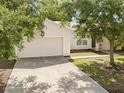 Lovely single-story home featuring an attached garage, and well-manicured landscaping at 672 Reindeer Dr, Kissimmee, FL 34759
